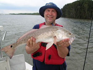 a happy fisherman with daytona's captian barry